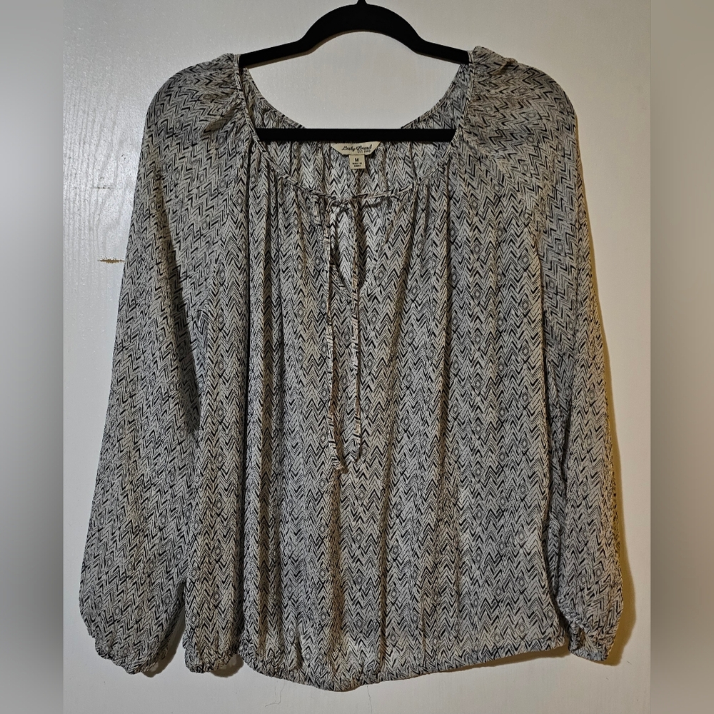 Lucky Brand 100% Silk blouse featuring a black and white abstract pattern